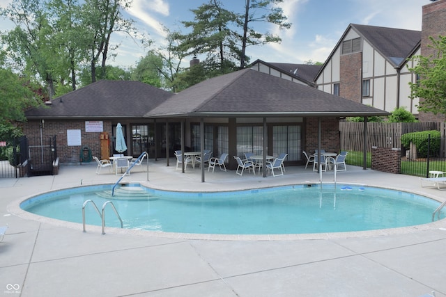 view of swimming pool with a patio