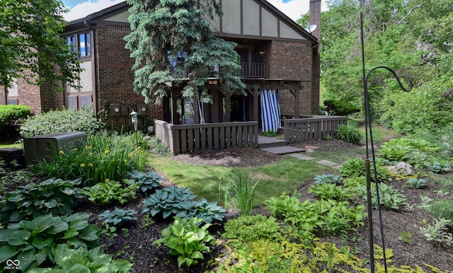 rear view of house featuring a balcony