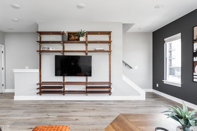 unfurnished living room with light wood-type flooring