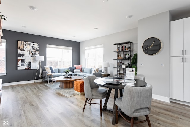 dining space featuring hardwood / wood-style flooring