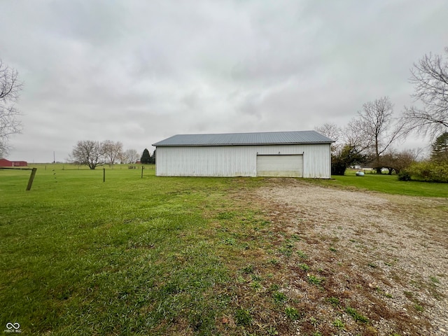 view of outbuilding with a lawn