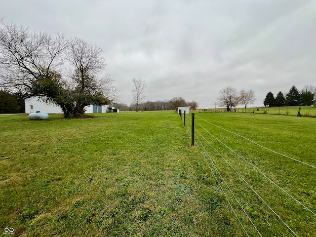 view of yard with a rural view