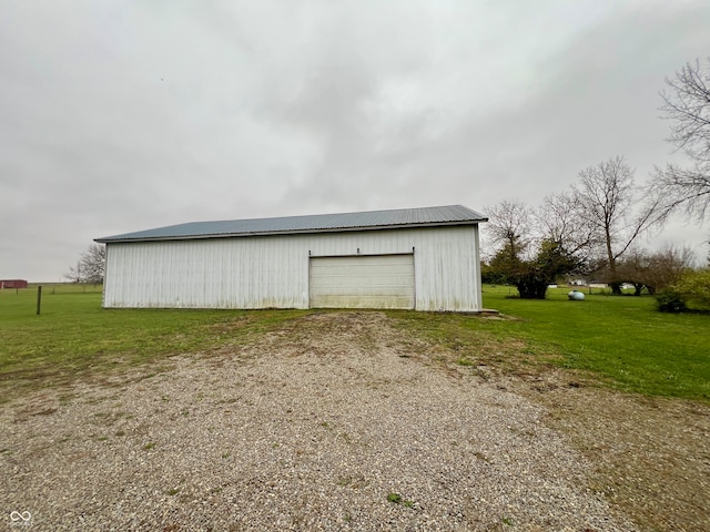 garage featuring a yard