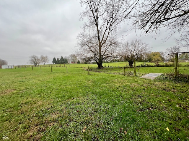 view of yard with a rural view