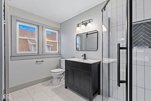 bathroom with vanity, toilet, and a shower with shower door