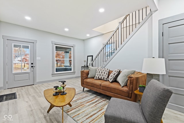 living room with light hardwood / wood-style floors