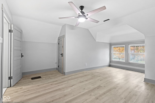 bonus room featuring ceiling fan, light hardwood / wood-style flooring, and lofted ceiling