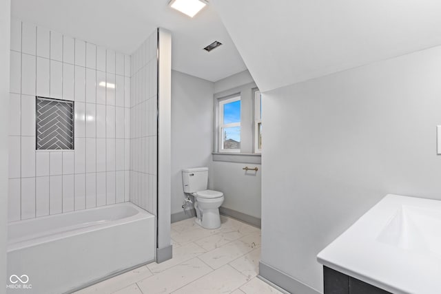 full bathroom with tiled shower / bath combo, toilet, and vanity