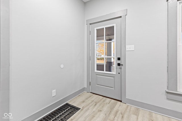 doorway to outside featuring light hardwood / wood-style floors