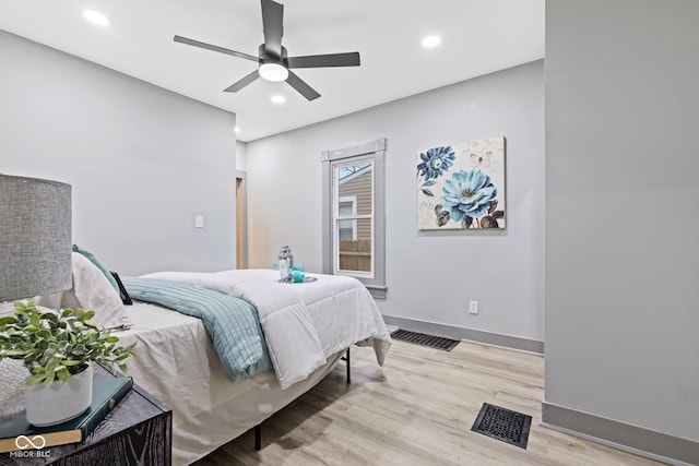 bedroom featuring light hardwood / wood-style flooring and ceiling fan