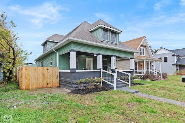 view of front facade featuring a front lawn and a porch