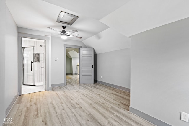 bonus room with ceiling fan, light wood-type flooring, and vaulted ceiling