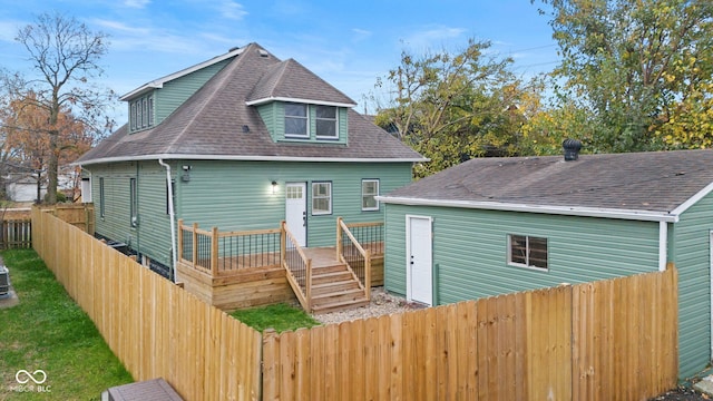 rear view of property featuring a deck