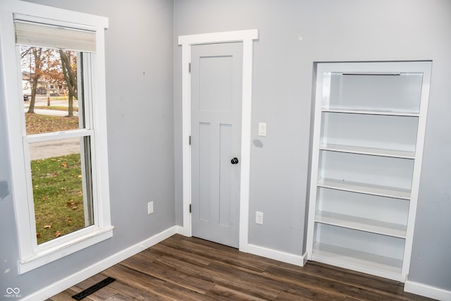 interior space with dark hardwood / wood-style flooring