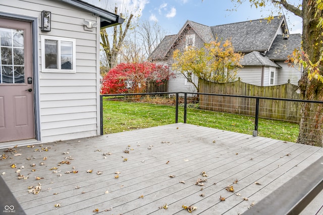 wooden deck with a lawn