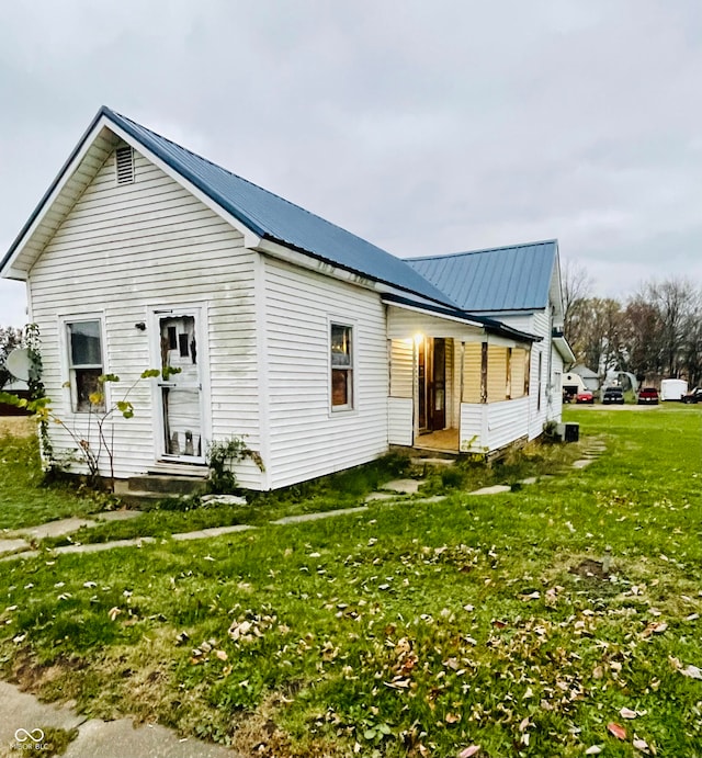 view of home's exterior featuring a lawn