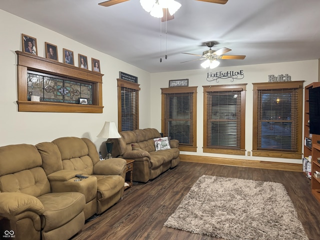 living room featuring ceiling fan and dark hardwood / wood-style flooring