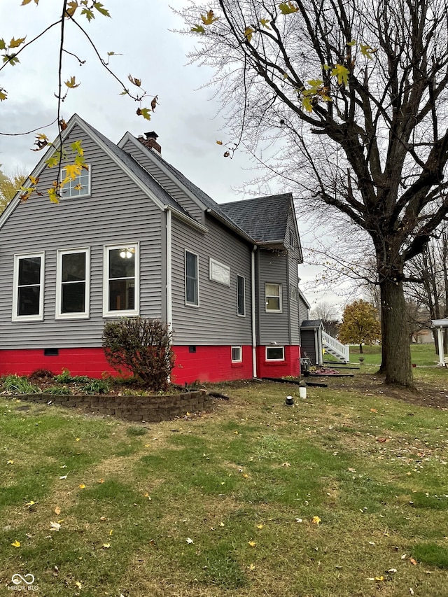 view of home's exterior featuring a lawn