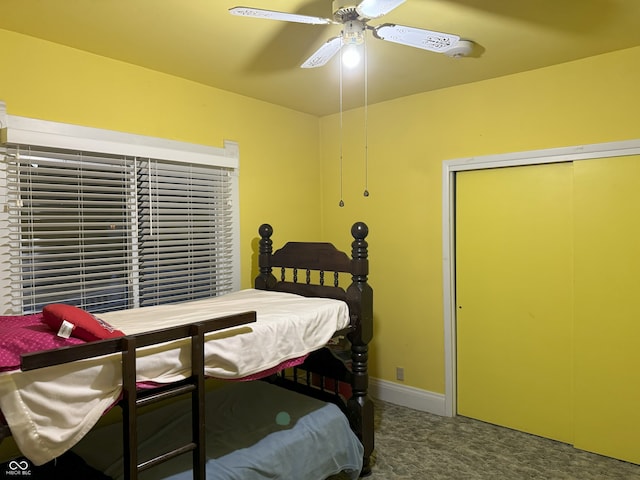 bedroom with ceiling fan, a closet, and carpet