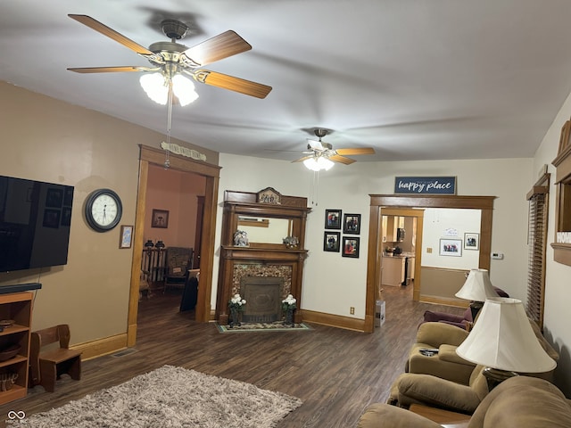 living room with dark hardwood / wood-style floors and ceiling fan