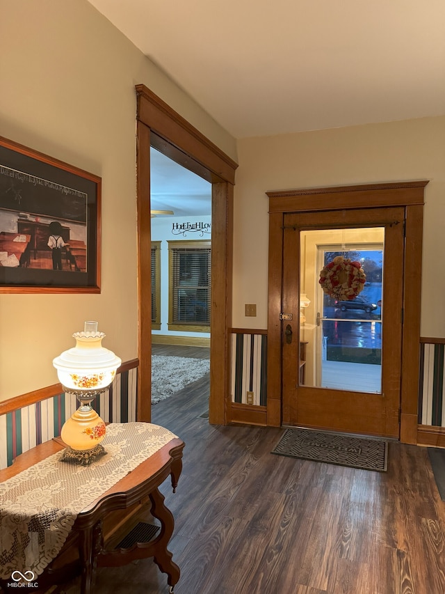 foyer with dark hardwood / wood-style floors