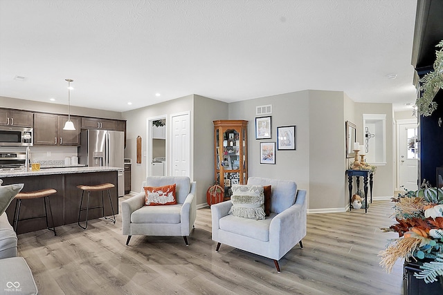 living room featuring light wood-type flooring