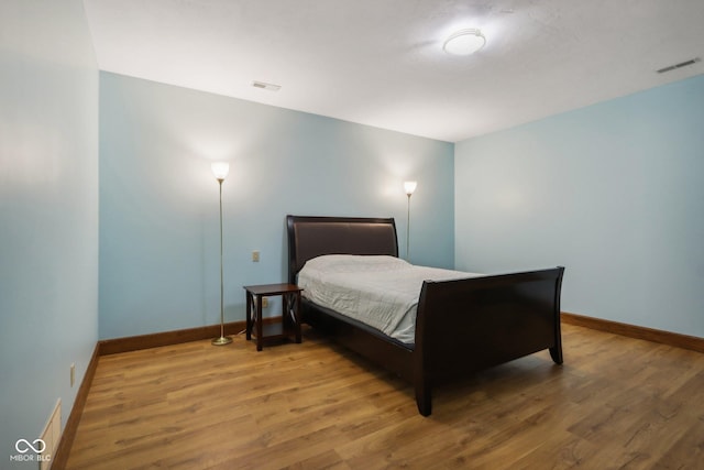 bedroom featuring hardwood / wood-style floors