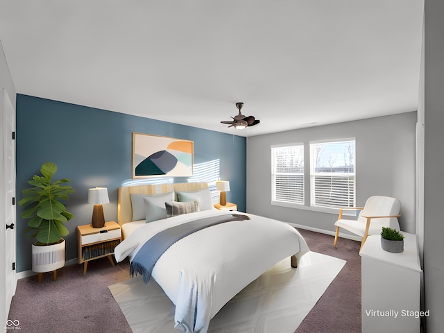 bedroom featuring dark carpet and ceiling fan