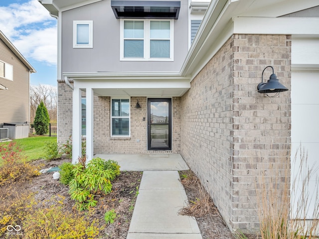 doorway to property featuring a patio area