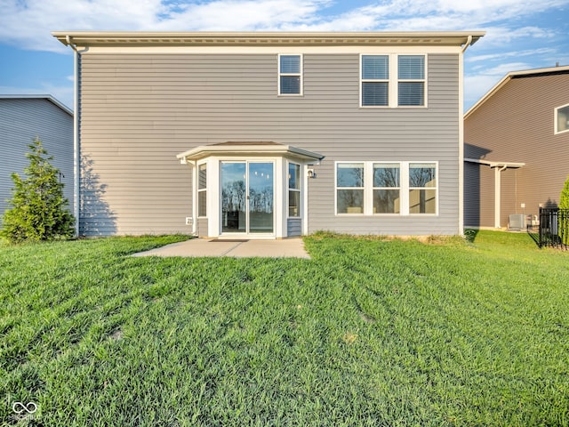 back of house featuring a yard, a patio, and cooling unit