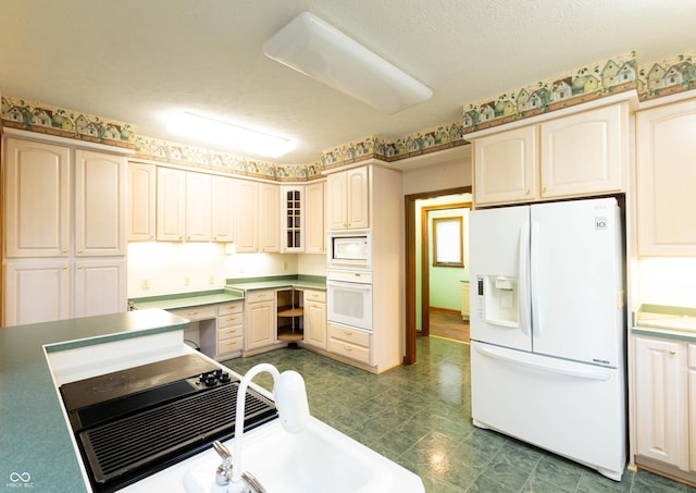 4257 Tattersall Dr, Plainfield, IN 46168 - kitchen featuring white appliances, dark floors, glass insert cabinets, and built in study area