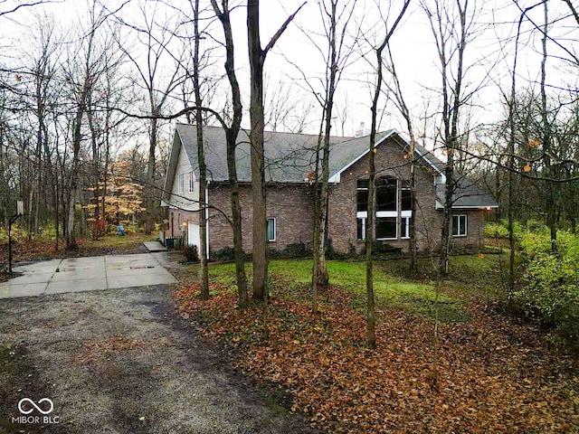 view of side of property with a garage