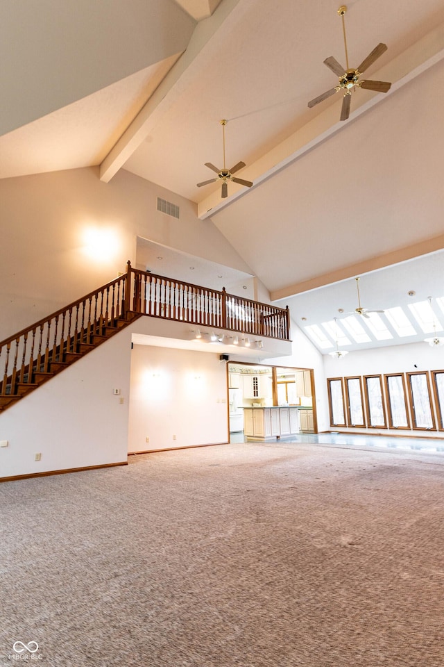 4257 Tattersall Dr, Plainfield, IN 46168 - unfurnished living room featuring high vaulted ceiling, carpet flooring, ceiling fan, beamed ceiling, and baseboards