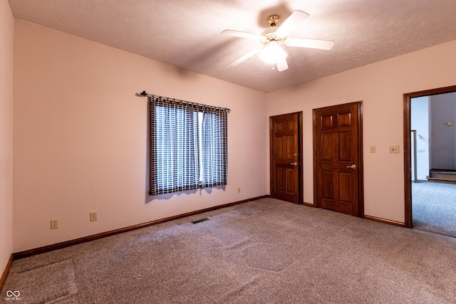 4257 Tattersall Dr, Plainfield, IN 46168 - unfurnished bedroom featuring carpet, baseboards, ceiling fan, and a textured ceiling