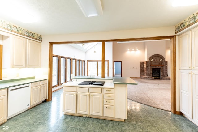 4257 Tattersall Dr, Plainfield, IN 46168 - kitchen featuring white dishwasher, black electric stovetop, a fireplace, open floor plan, and carpet flooring