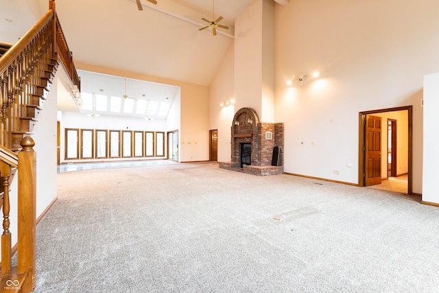 4257 Tattersall Dr, Plainfield, IN 46168 - unfurnished living room with high vaulted ceiling, a brick fireplace, carpet floors, a ceiling fan, and baseboards
