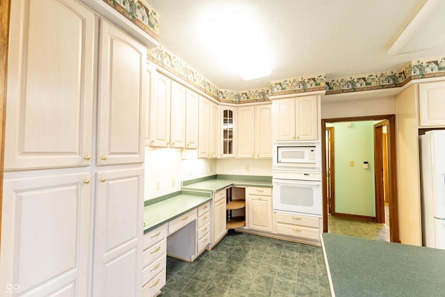 4257 Tattersall Dr, Plainfield, IN 46168 - kitchen with white appliances, glass insert cabinets, light countertops, and dark floors