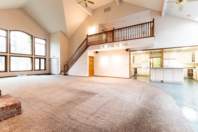 4257 Tattersall Dr, Plainfield, IN 46168 - unfurnished living room featuring a ceiling fan, high vaulted ceiling, beamed ceiling, stairway, and baseboards