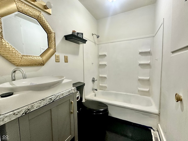 full bathroom with washtub / shower combination, vanity, and toilet