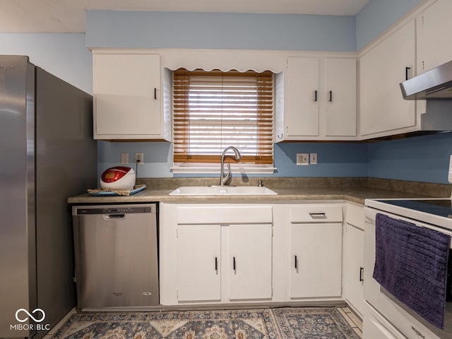 kitchen with sink, white cabinets, and stainless steel appliances