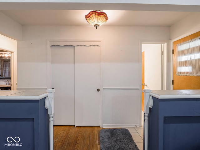 bathroom with wood-type flooring