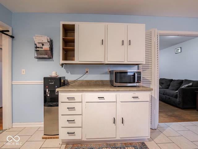 kitchen featuring white cabinets and light hardwood / wood-style floors