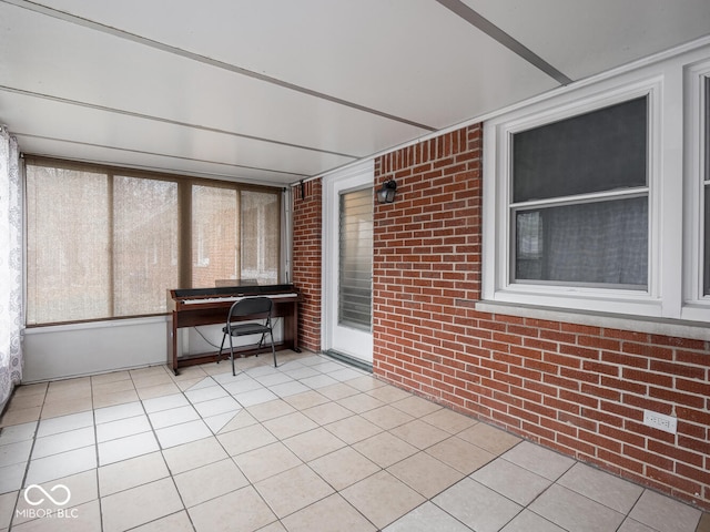 unfurnished sunroom featuring a wealth of natural light