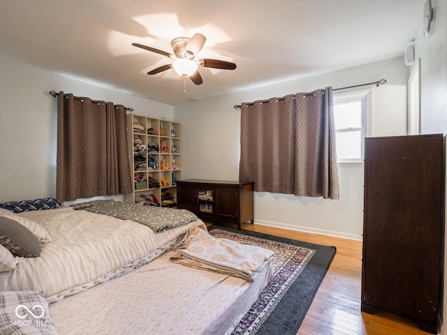 bedroom featuring ceiling fan and light hardwood / wood-style floors