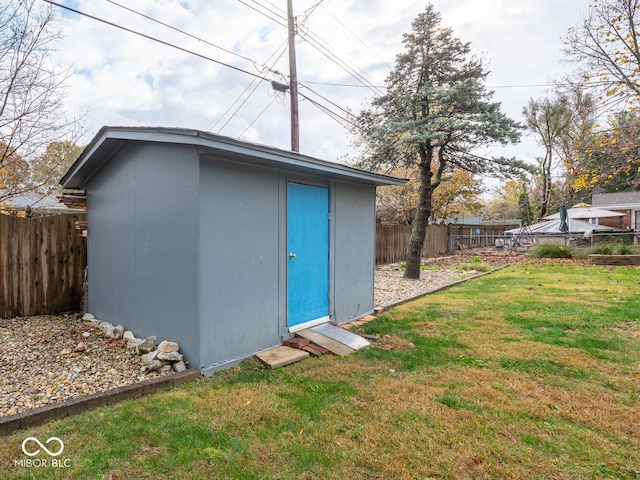 view of outbuilding with a lawn