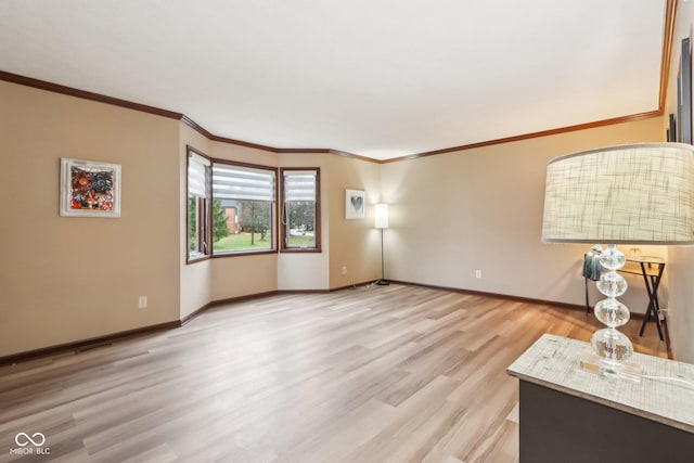 unfurnished living room featuring light hardwood / wood-style flooring and ornamental molding