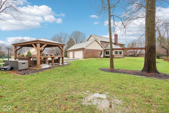 view of yard with a gazebo and a garage