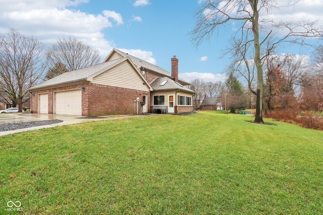 view of front of house with a garage and a front lawn