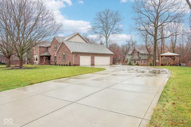 view of side of home featuring a lawn, a gazebo, and a garage