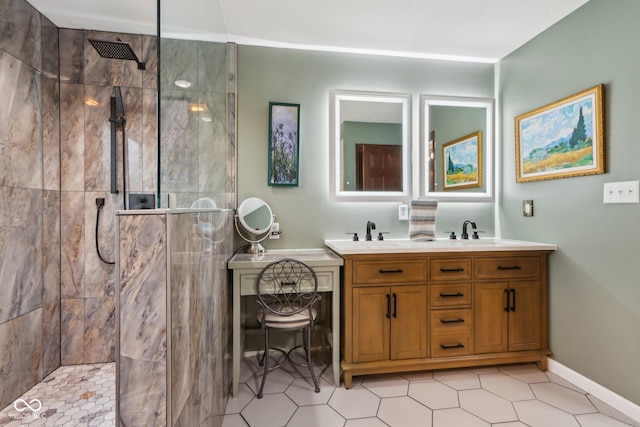 bathroom featuring tiled shower and vanity